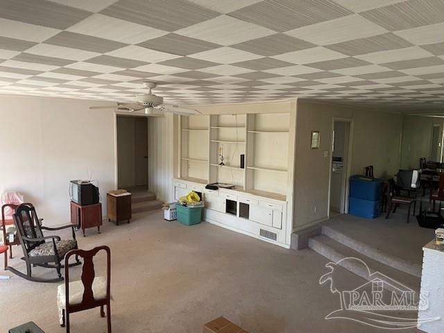 living room featuring ceiling fan