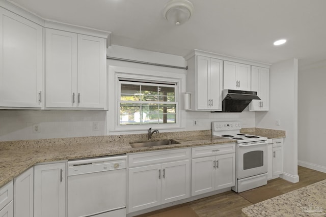 kitchen featuring sink, hardwood / wood-style floors, white cabinets, and white appliances