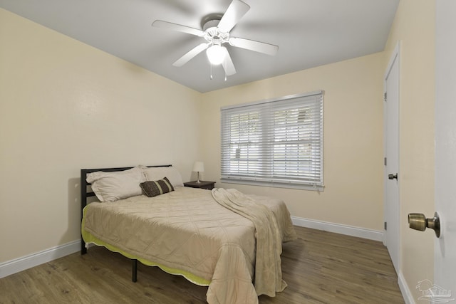 bedroom featuring ceiling fan and wood-type flooring