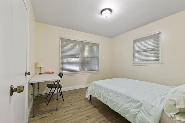 bedroom with light hardwood / wood-style floors