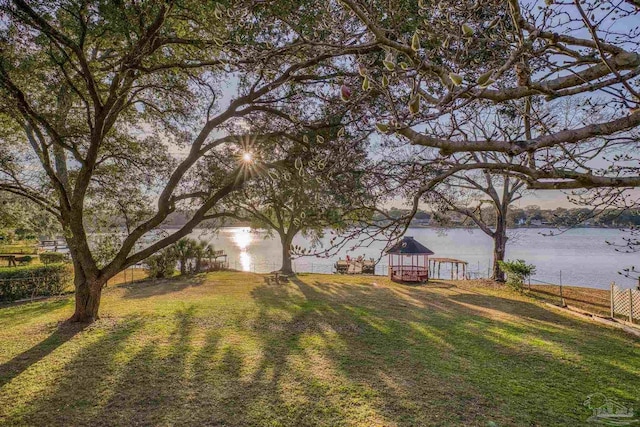 view of yard with a gazebo and a water view