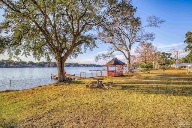 view of yard featuring a gazebo and a water view