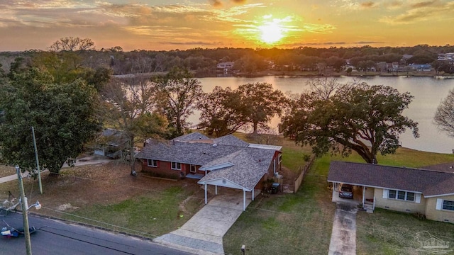 aerial view at dusk with a water view