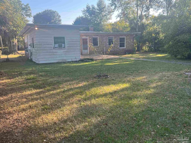 ranch-style house with a front lawn