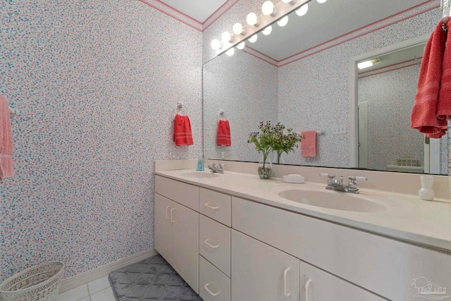 bathroom featuring ornamental molding, tile patterned floors, and vanity