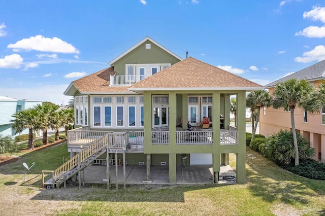 rear view of house with a yard