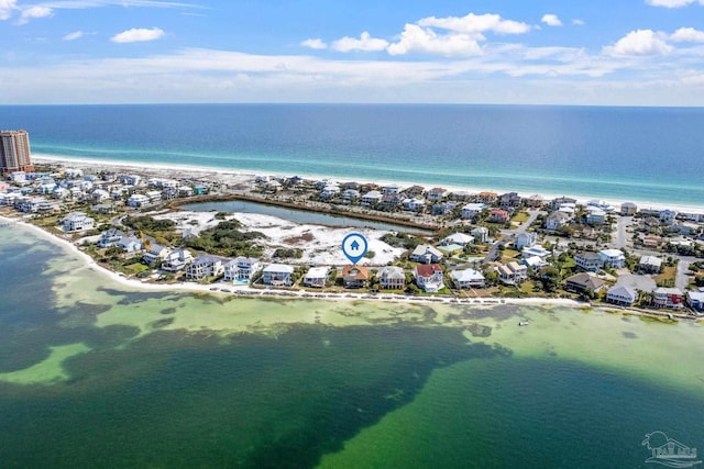 drone / aerial view featuring a water view and a beach view