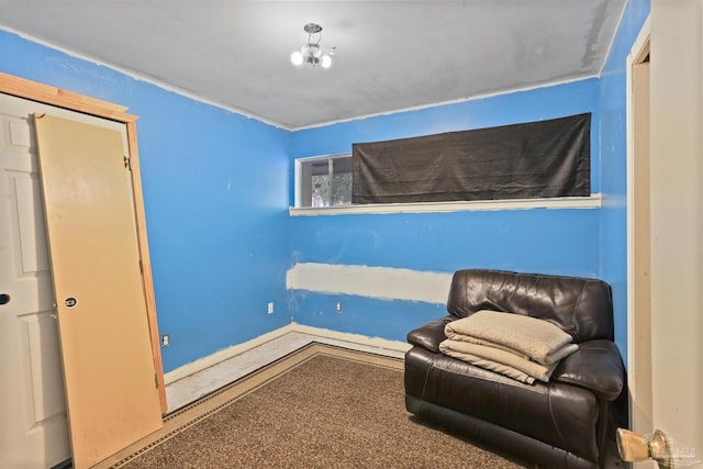 living area featuring baseboards