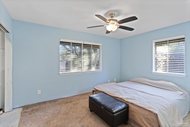 carpeted bedroom featuring a ceiling fan