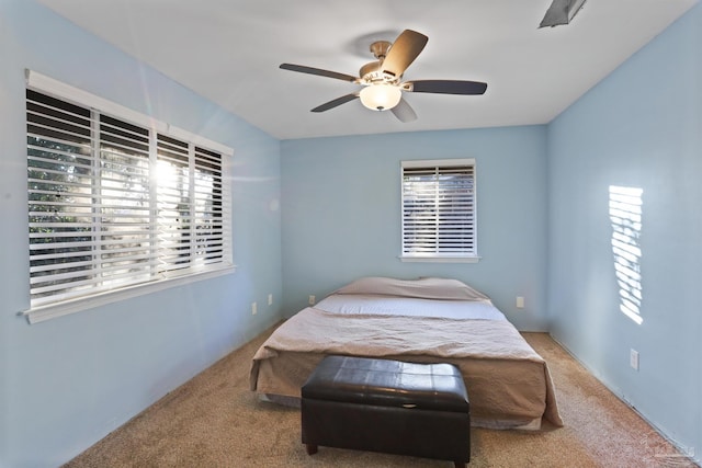 bedroom with carpet and a ceiling fan