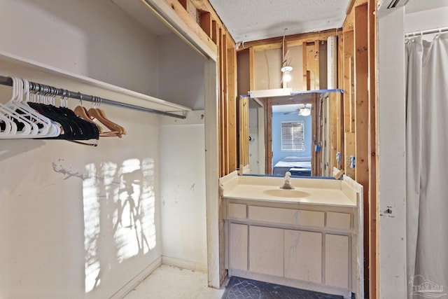 bathroom with vanity and ensuite bath