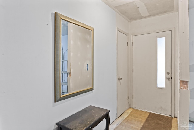 foyer entrance with light wood-style flooring