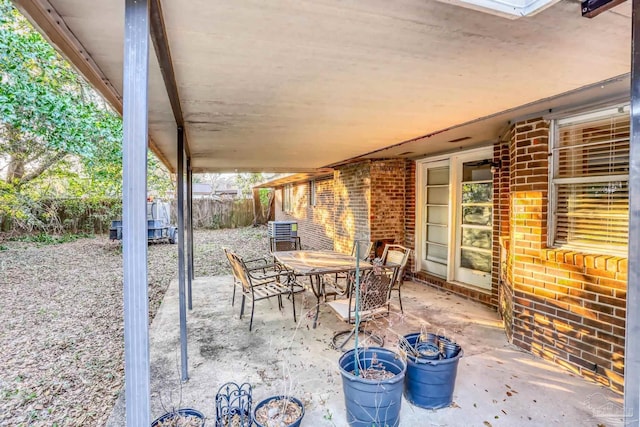 view of patio / terrace with outdoor dining area and fence