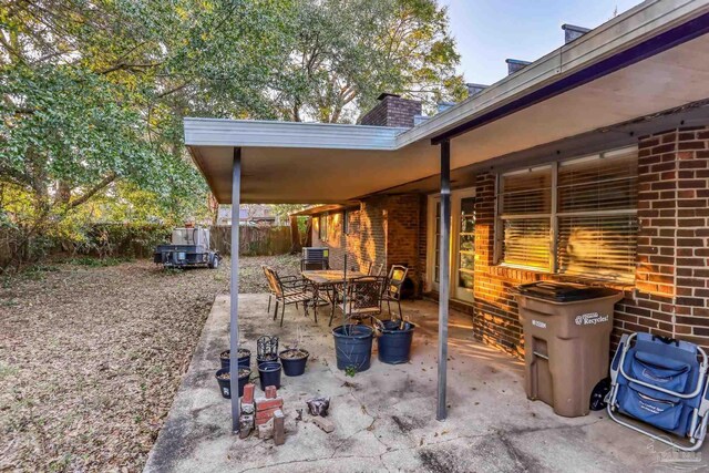 view of patio featuring fence