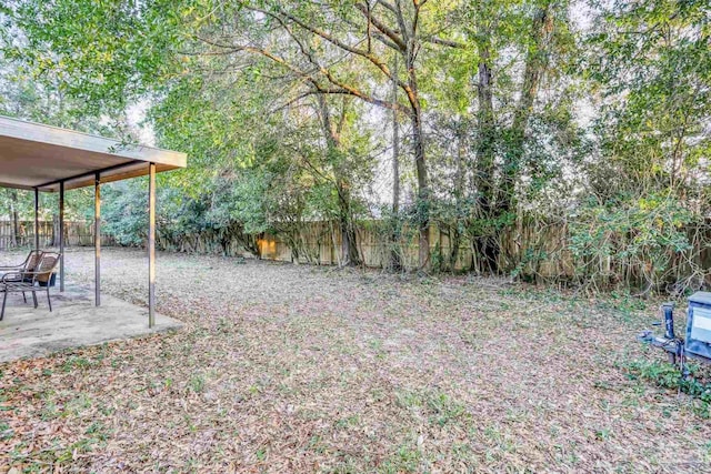 view of yard with a fenced backyard and a patio