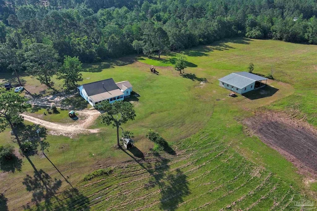 birds eye view of property with a rural view and a forest view