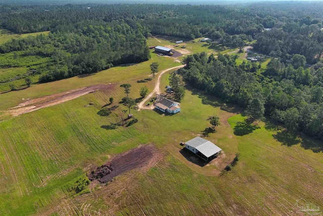 drone / aerial view with a rural view and a view of trees