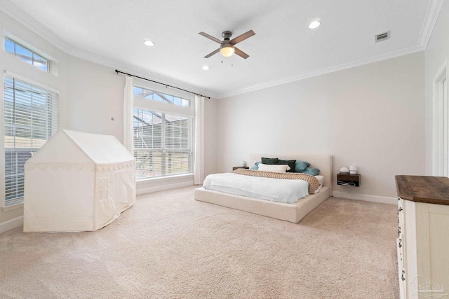 bedroom featuring crown molding, multiple windows, visible vents, and light colored carpet