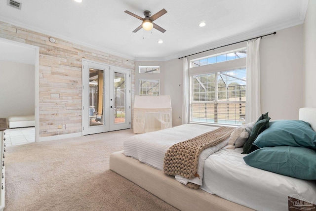 bedroom with visible vents, french doors, light colored carpet, and crown molding