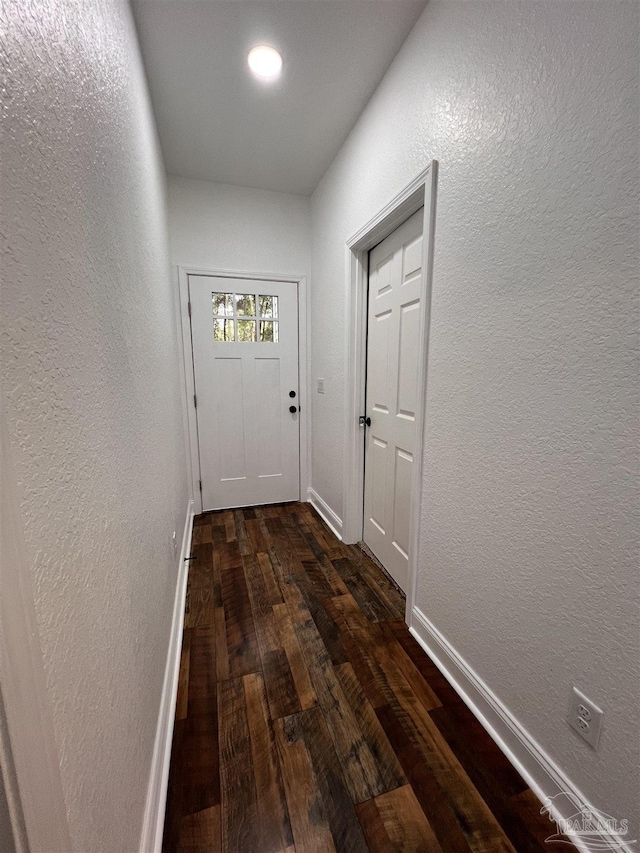 doorway to outside with dark hardwood / wood-style flooring