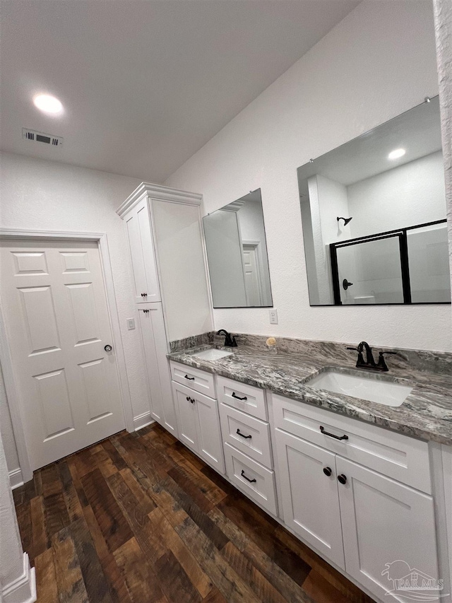 bathroom featuring hardwood / wood-style flooring and vanity