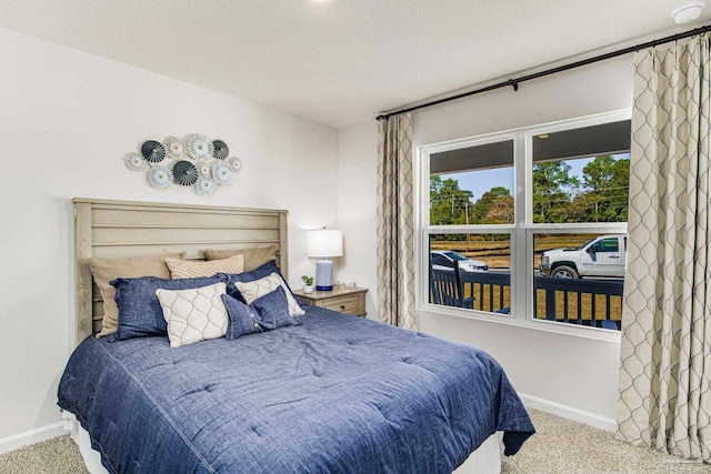 bedroom featuring light carpet