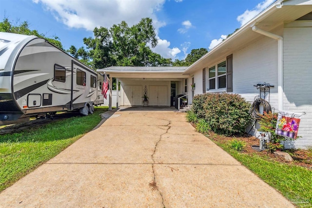 2543 Bayview Way, Pensacola, FL 32503 - view of front of home featuring driveway, an attached carport, and brick siding