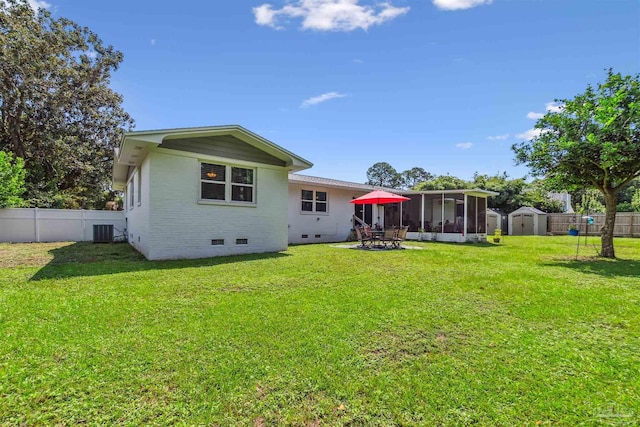 2543 Bayview Way, Pensacola, FL 32503 - back of house featuring crawl space, a sunroom, central air condition unit, and brick siding