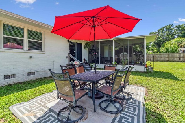 2543 Bayview Way, Pensacola, FL 32503 - view of patio with outdoor dining area and a sunroom