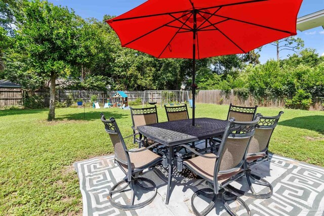 2543 Bayview Way, Pensacola, FL 32503 - view of patio / terrace with outdoor dining space and view of scattered trees