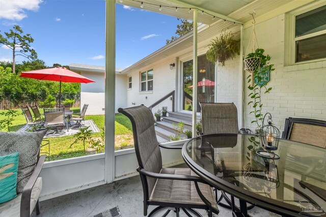 2543 Bayview Way, Pensacola, FL 32503 - sunroom with outdoor dining space and entry steps