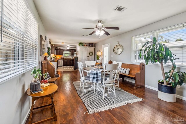 2543 Bayview Way, Pensacola, FL 32503 - dining space featuring a ceiling fan, healthy amount of natural light, baseboards, and dark wood-type flooring