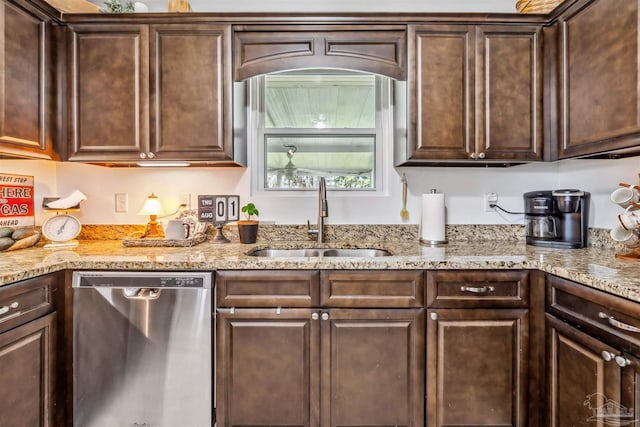 2543 Bayview Way, Pensacola, FL 32503 - kitchen with stainless steel dishwasher, a sink, dark brown cabinetry, and light stone counters
