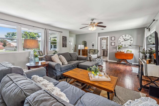 2543 Bayview Way, Pensacola, FL 32503 - living area with dark wood finished floors, ceiling fan, and baseboards