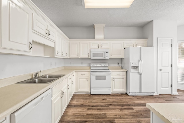 kitchen with a textured ceiling, white appliances, dark wood-type flooring, sink, and white cabinetry