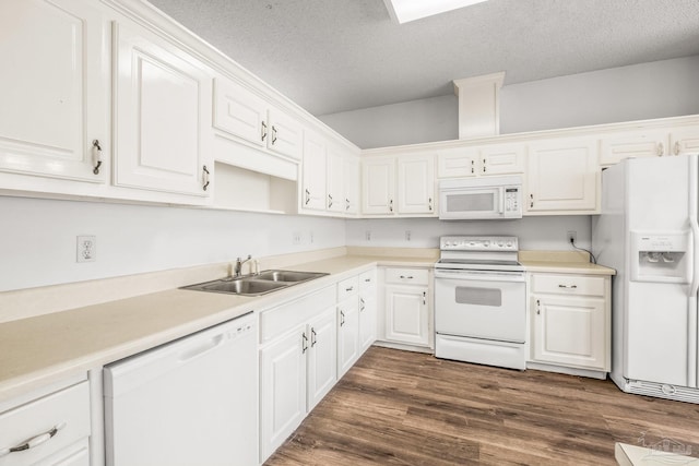 kitchen with a textured ceiling, white cabinetry, dark wood-type flooring, and white appliances