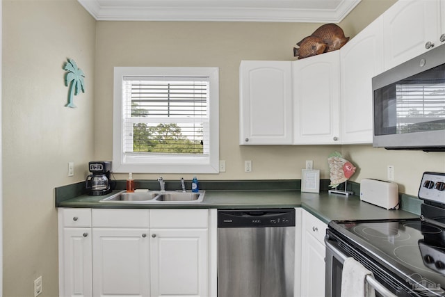 13555 Perdido Key Dr Unit A17U, Pensacola, FL 32507 - kitchen featuring stainless steel appliances, dark countertops, ornamental molding, and white cabinets