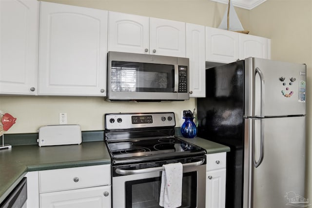 13555 Perdido Key Dr Unit A17U, Pensacola, FL 32507 - kitchen featuring stainless steel appliances, dark countertops, and white cabinets