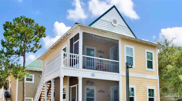 13555 Perdido Key Dr Unit A17U, Pensacola, FL 32507 - view of home's exterior with stairs and a sunroom