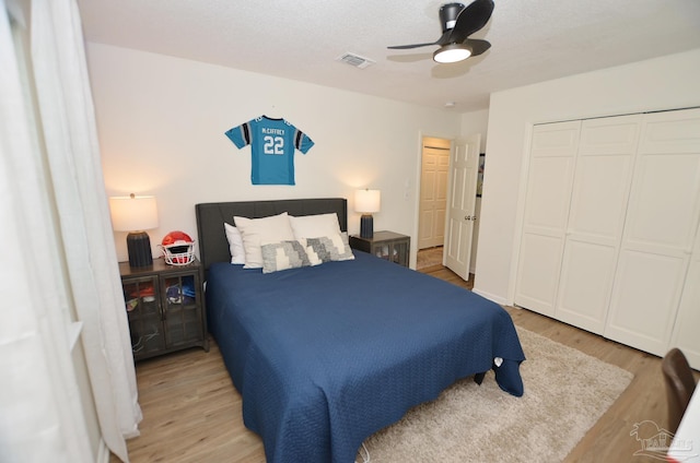 bedroom with ceiling fan and light hardwood / wood-style flooring