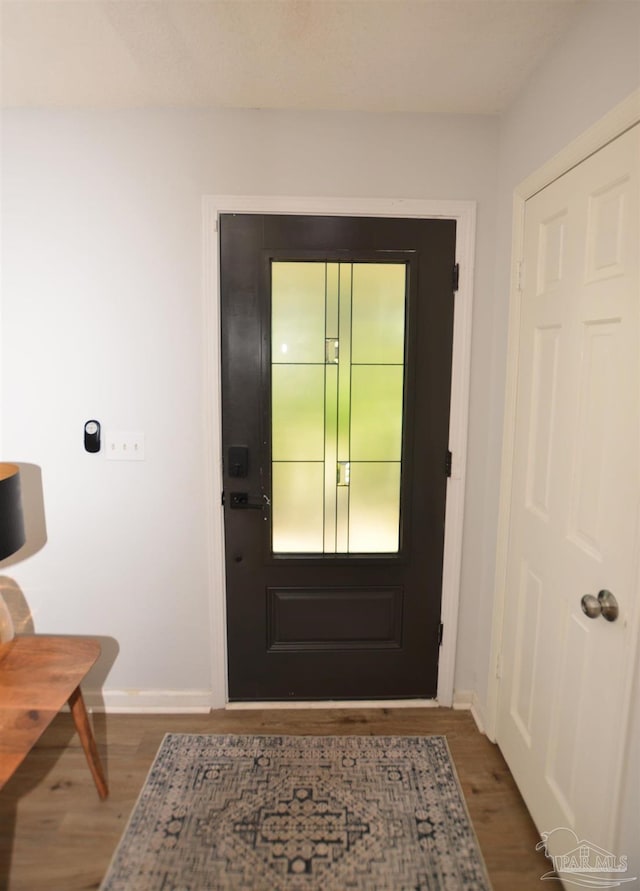 doorway featuring dark hardwood / wood-style flooring