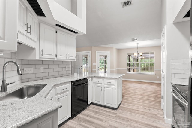 kitchen with hanging light fixtures, black dishwasher, kitchen peninsula, stove, and white cabinets