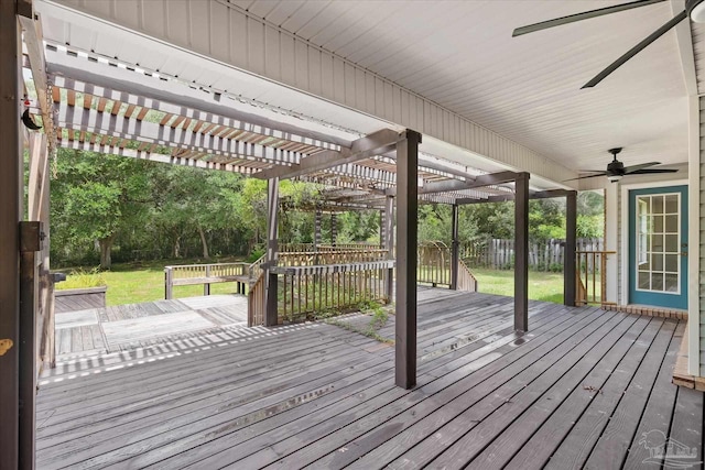 wooden deck with a yard, a pergola, and ceiling fan