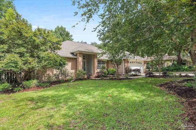 ranch-style house with a garage and a front lawn