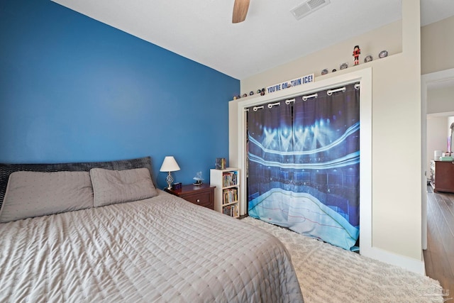 bedroom featuring baseboards, visible vents, and a ceiling fan