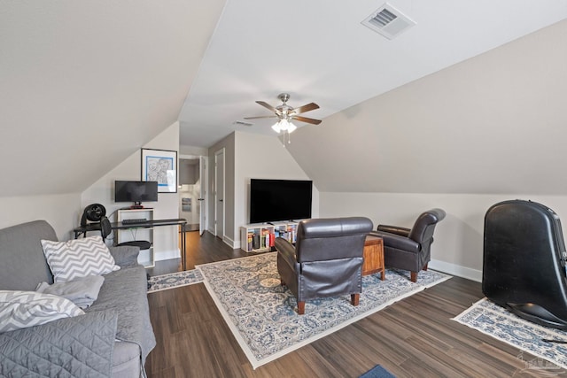 office space featuring ceiling fan, lofted ceiling, visible vents, baseboards, and dark wood-style floors