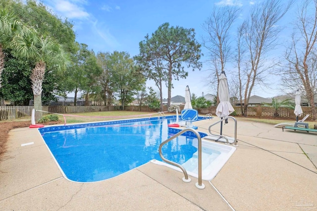 view of swimming pool with fence, a fenced in pool, and a patio