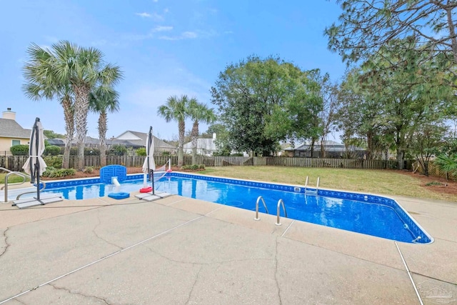 view of pool with a fenced in pool, a patio area, a fenced backyard, and a lawn