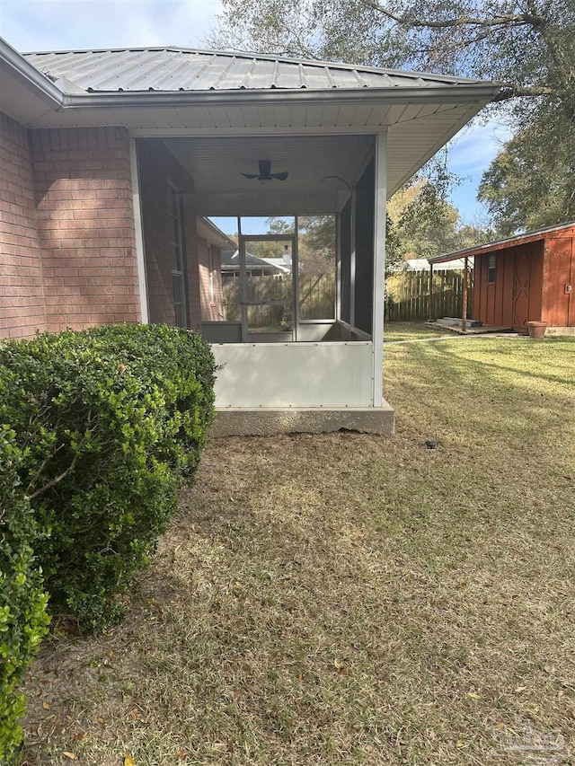 exterior space featuring fence and a lawn