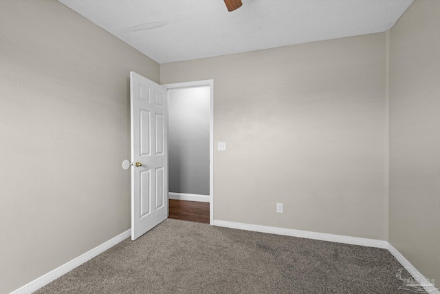 unfurnished room with carpet flooring and ceiling fan